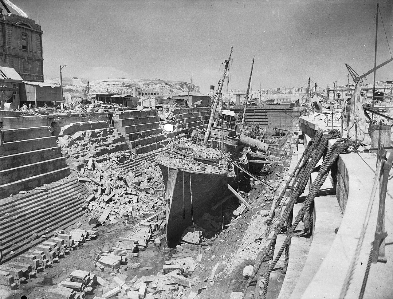 The armed trawler HMS Coral within a bomb-damaged Dry Dock No 3 (Somerset Dock) during World War II