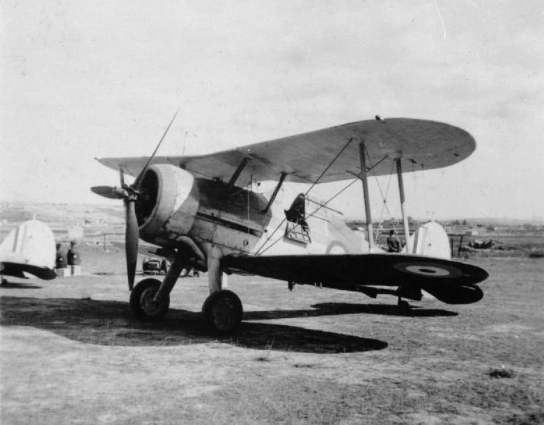 Faith (serial number N5520), a Gloster Sea Gladiator Mk I, on the ground at an airfield in Malta, in about September 1940. The aircraft has been refitted with a Bristol Mercury XV engine and three-blade Hamilton Standard variable-pitch propeller salvaged from a Bristol Blenheim.