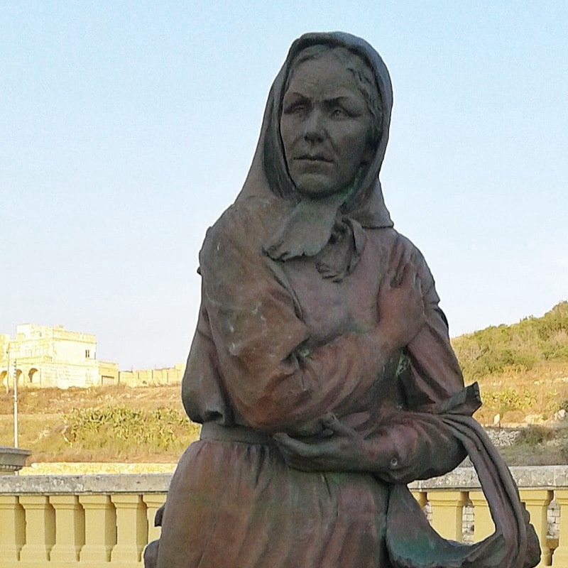 A statue of Karmni Grima outside Ta' Pinu Sanctuary in Gozo, Malta.