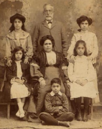 Cabinet photo of the family of Jacob Israel, from Corfu, and his wife Zula Zenzouri, from Sfax, taken in Valletta, circa 1900